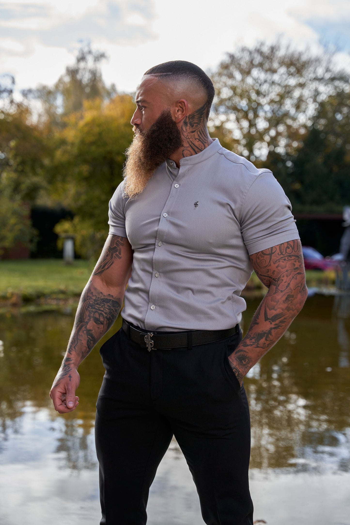 Elevate Your Wardrobe with Father Sons Super Slim Stretch Grey Denim Short Sleeve Shirt Featuring a Stylish Grandad Collar, Sleek Silver Metal Buttons, and Eye-Catching Decal - FS963
