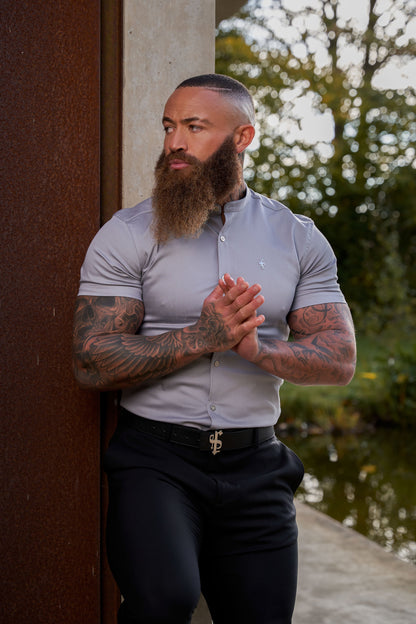 Elevate Your Wardrobe with Father Sons Super Slim Stretch Grey Denim Short Sleeve Shirt Featuring a Stylish Grandad Collar, Sleek Silver Metal Buttons, and Eye-Catching Decal - FS963
