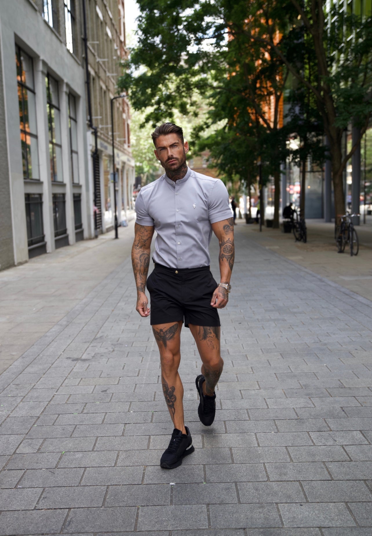 Elevate Your Wardrobe with Father Sons Super Slim Stretch Grey Denim Short Sleeve Shirt Featuring a Stylish Grandad Collar, Sleek Silver Metal Buttons, and Eye-Catching Decal - FS963