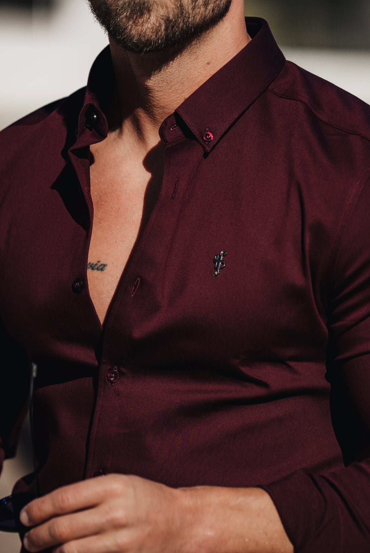 Elevate Your Style with Our Burgundy Super Slim Stretch Denim Long Sleeve Shirt Featuring a Sleek Metal Decal Emblem - FS628